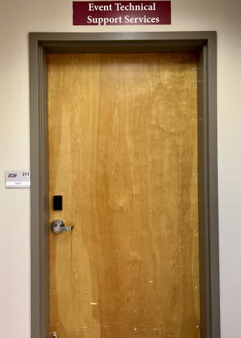 Image of Tech Crew storage and office door, room 211